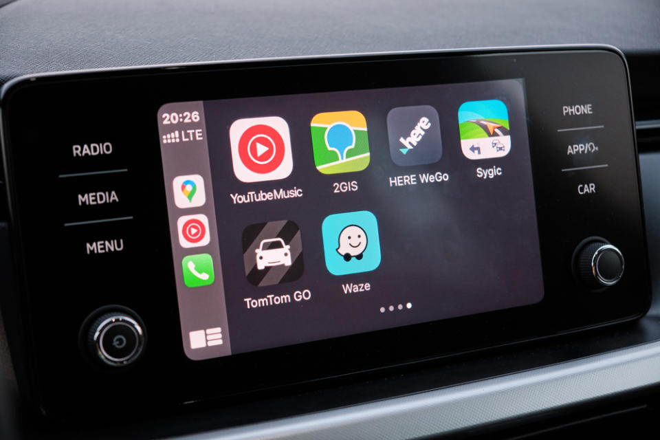 Car dashboard showing Apple CarPlay running on iOS 18.4.1