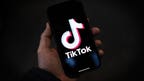 Smartphone showing TikTok Downdetector reports